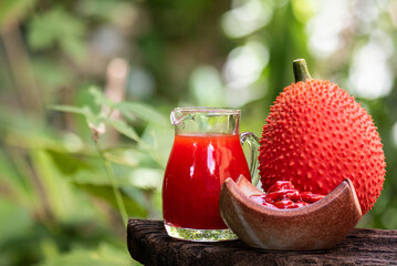 Gac fruit and juice on natural background.