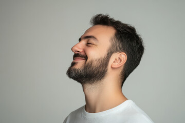Obraz premium A close up of a man's face with his eyes closed