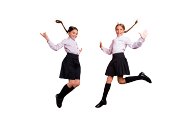 Full length body size view of two person nice attractive charming cute excited cheerful cheery positive pre-teen girls having fun rejoice September isolated on bright vivid shine orange background