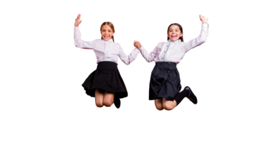 Full length body size view of two person nice attractive charming cheerful pre-teen girls having fun holding hands great new year 1 September isolated over bright vivid shine orange background