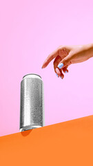 Aluminum can against minimalistic pink and orange background. Mockup. Beer, lemonade, energy...