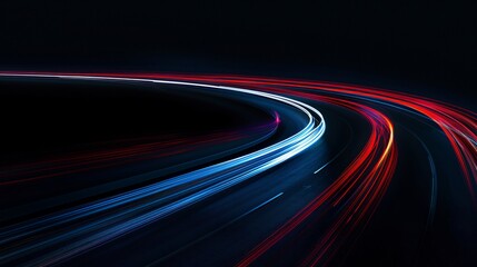 Abstract image of night traffic lights on the road. Car light trails at night in curve asphalt road. Long exposure showing movement of cars from bridge or drone