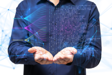 Man in a blue shirt holding a holographic digital data visualization with binary code and network connections on a white background, illustrating data analysis and technology concepts