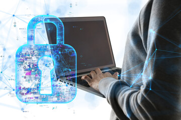 A person typing on a laptop with a holographic lock overlay on a white background. Concept of cybersecurity and data protection