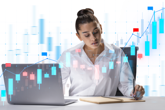 Businesswoman analyzing financial data on a laptop with holographic graphs overlay, sitting at desk. Concept of data analysis and finance