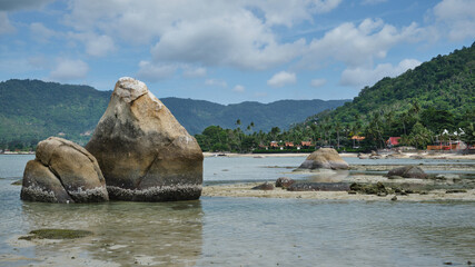 View of boulders at low tide near Lamai Beach, Koh Samui, Thailand.