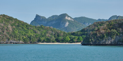 Panaroma of mountains and deserted beach on an island in  Mu Ko Ang Thong Marine Park, Thailand