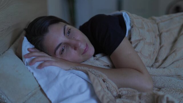 Nighttime Bliss Smiling Woman Preparing for Bed in a Calm Bedroom
