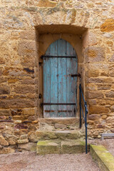 Fototapeta premium old blue door with a wooden frame