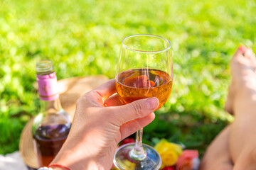 Wine flowers picnic in the garden woman. Selective focus.