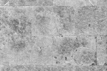 Smooth gray block stone wall with unique natural textures and patterns. Abstract background