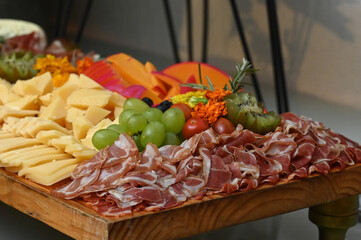 meat and fruits, cheese and fruit, cheese and fruits, cheese and grapes, cold dish, cold cuts, appetizer, cheese and wine, snacks