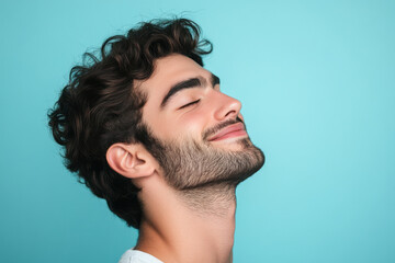 Obraz premium A close up of a man's face with his eyes closed