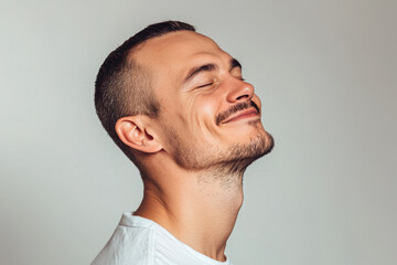 Obraz premium A close up of a man's face with his eyes closed
