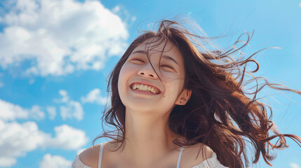 Beautiful Asian Korean woman with her smile on a sky blue background