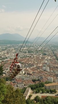 Top station of Telepherique de Grenoble Bastille or Crenoble's cable car, also known as Les bulles or the bubbles, France, vertical video
