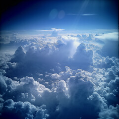 view from airplane window clouds above the sky