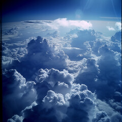 view from airplane window clouds above the sky