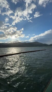 Beautiful view of Lake Maggiore and the ancient town of Raco in Italy. Strong wind and rain