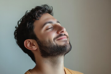 Fototapeta premium A close up of a man's face with his eyes closed