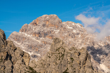 High cliffs of Dolomites against  blue sky. Rock peaks. South Tyrol, Italy