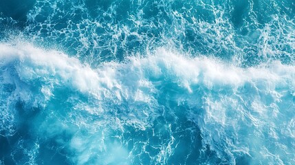Fototapeta premium aerial view of turquoise ocean water with splashes and foam for abstract natural background and texture 