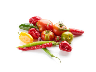 tomatoes and different peppers isolated on white background