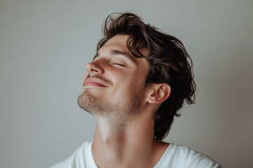 Fototapeta premium A close up of a man's face with his eyes closed