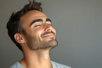 Fototapeta premium A close up of a man's face with his eyes closed