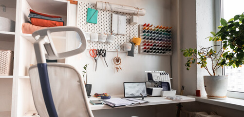 A Cozy Creative Workspace seamstress Featuring Organized Supplies and Abundant Natural Light That Inspires