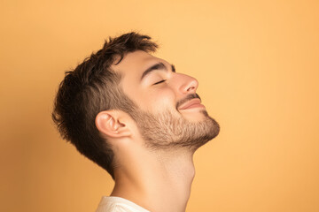 Obraz premium A close up of a man's face with his eyes closed