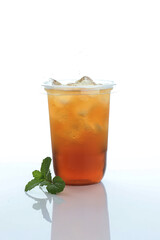 Cold Ice Tea with Mint Leaf on White Table