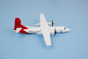Airplane model on blue background. 