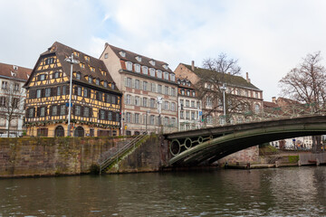 Bridges and old buildings on the embankment of the river Ile