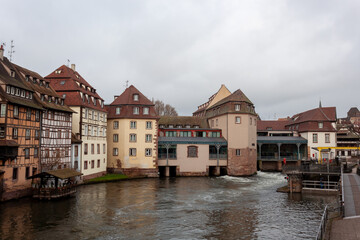 Bridges and old buildings on the embankment of the river Ile