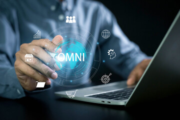 Omni channel technology of online retail business , Digital online marketing, Businessman use laptop with omni channel icons on virtual screen for business and social media marketing.