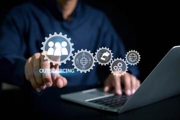 Outsourcing Global Recruitment Business and internet concept . Business person hand holding...