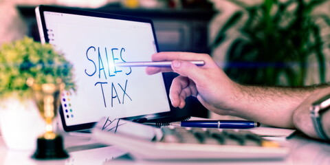 Sales tax note. Business concept of the amount of money a company pays its employees, paying taxes