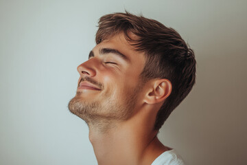 Fototapeta premium A close up of a man's face with his eyes closed