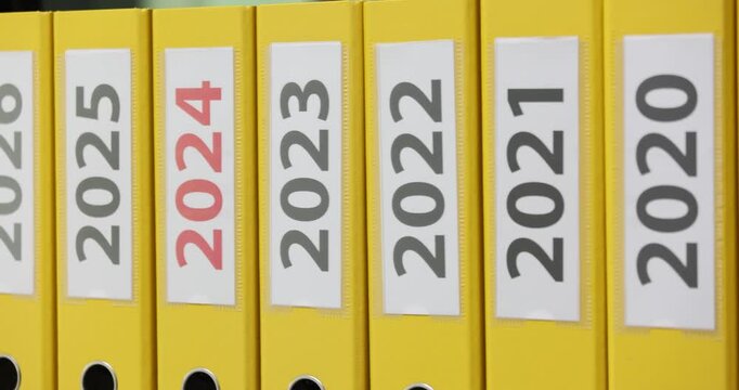 Yellow office folders with dates 2017 2028