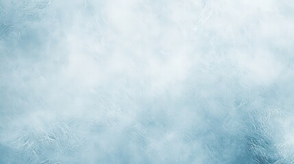Fototapeta premium A soft, textured blue background resembling ice or frost, suitable for graphic design.