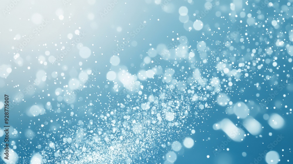 Poster a sparkling blue background with soft bokeh effects and light reflections.