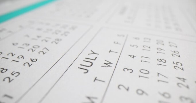 Calendar closeup with days and dates. Paper calendar template numbers and letters closeup