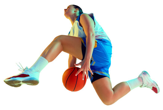 Low angle shot of young basketball player leaping to make powerful slam dunk in neon light against transparent background. Concept of professional sport, championship, tournament, recreation. Ad