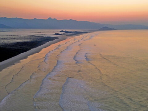 Aerial view of Itaguare beach, Bertioga, Brazil in early sunset
