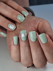 The beauty of the natural nails. Perfect clean manicure. New trendy nail arts on young women hand