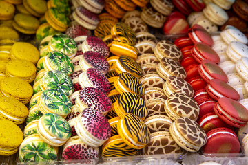 Delicious, mouth-watering, colorful macaroons on a shop window