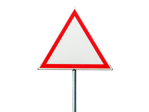 a triangular sign with a blue sky and clouds in the background