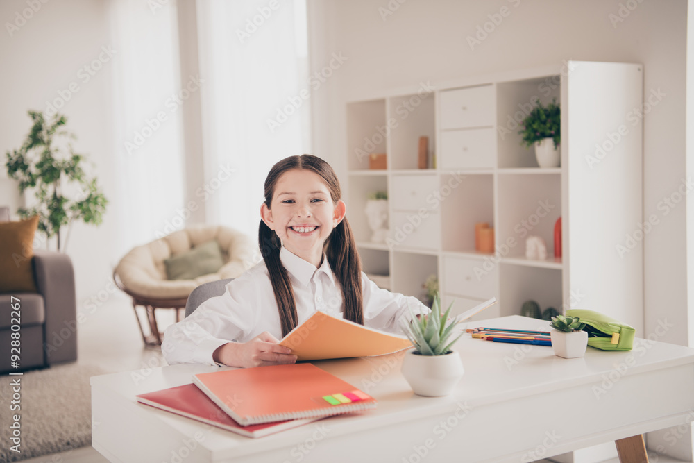 Canvas Prints Photo portrait of cute adorable girl cheerful smile homework textbook remote lesson education from home indoors