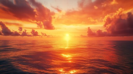 Fototapeta premium A stunning red sunset over calm ocean waters with vibrant clouds.